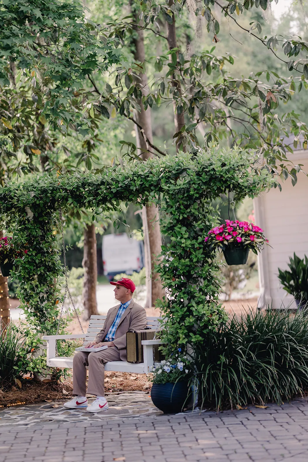 Get Gumped performer seated on a bench in a Savannah square