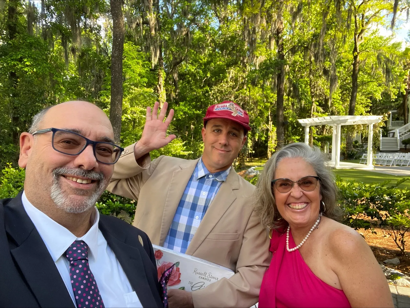 Guests posing with the Get Gumped performer in a park
